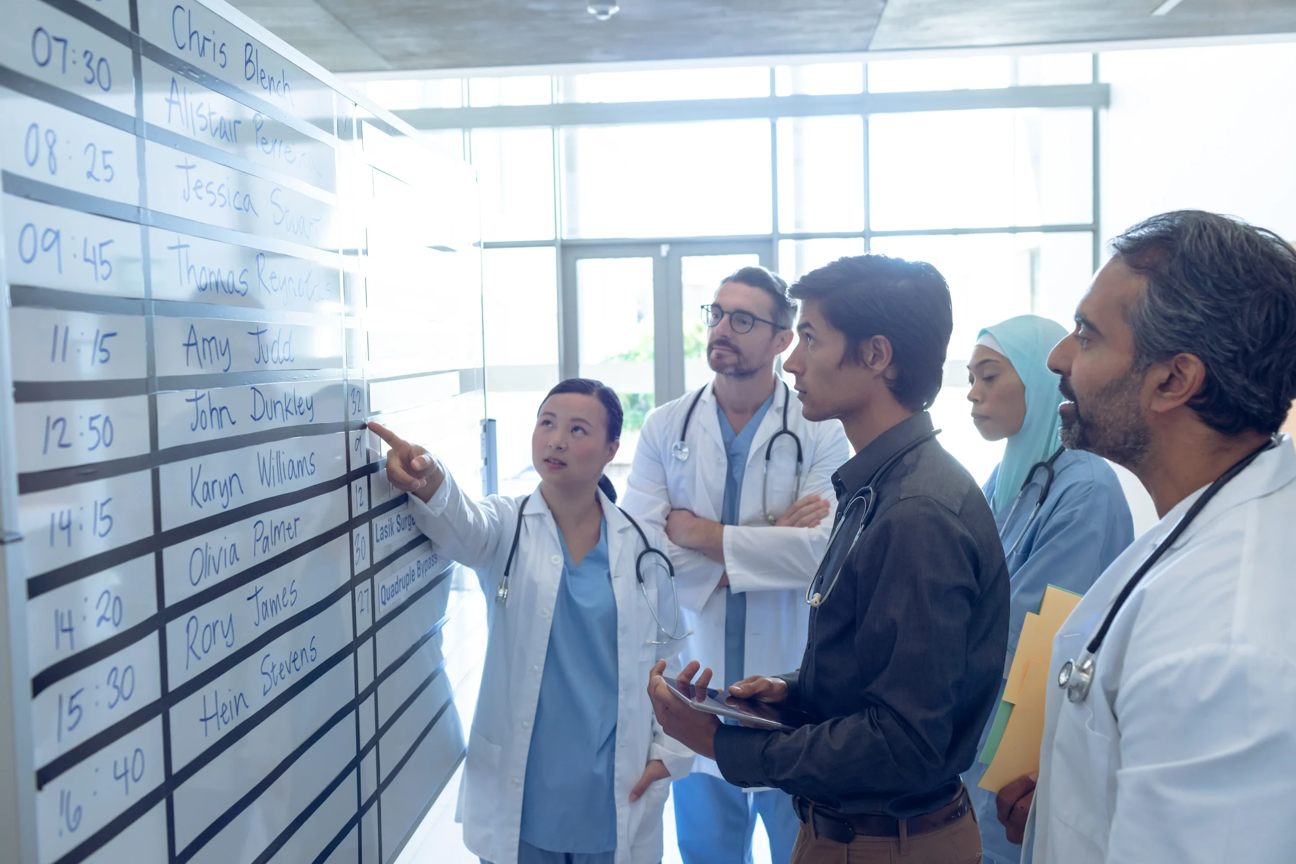 Program team reviewing a delivery plan and dates