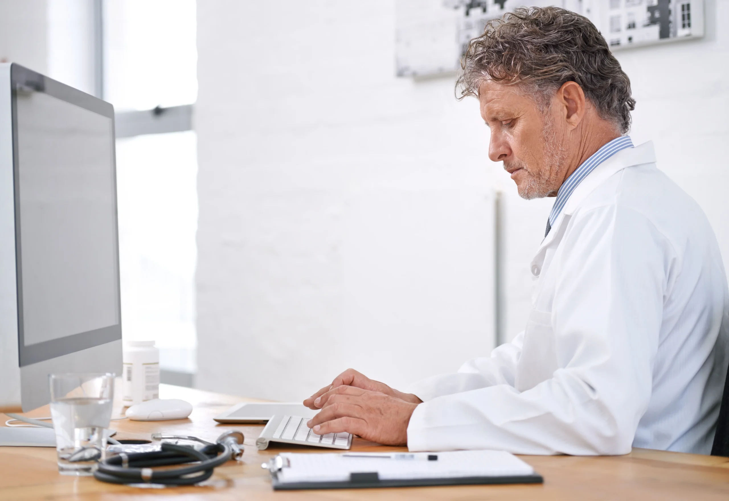 Physician reviewing clinical information at the point of care